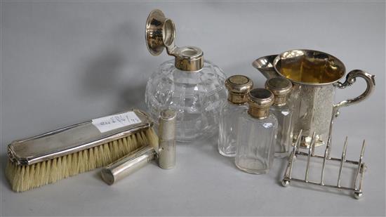 Assorted silver items including scent bottles, toastrack and brush etc.